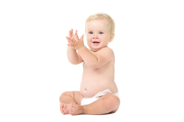 Baby girl sitting on white background - Valokuva, kuva