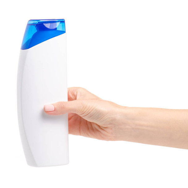 White shampoo bottle in hand on white background isolation - Foto, imagen
