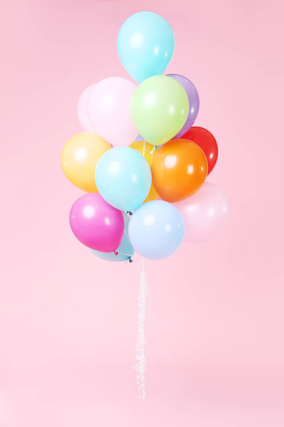 Colored balloons on pink background - Foto, Imagem