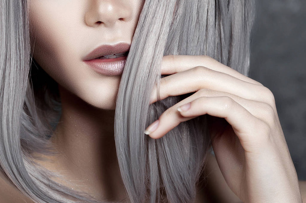 Young beautiful girl with silver make-up and ash hair. Anonymous beauty close-up portrait - 写真・画像