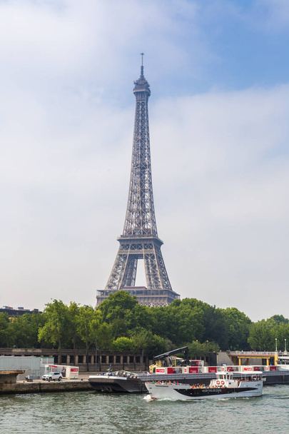 PARIS, FRANCE - JULY 14, 2014: Seine in Paris and Eiffel tower in beautiful summer day in Paris - Photo, Image