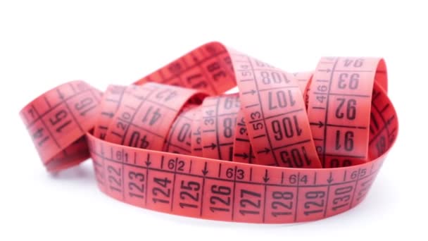 cinta métrica roja sobre fondo blanco, como el concepto de dieta y longitud
  - Metraje, vídeo