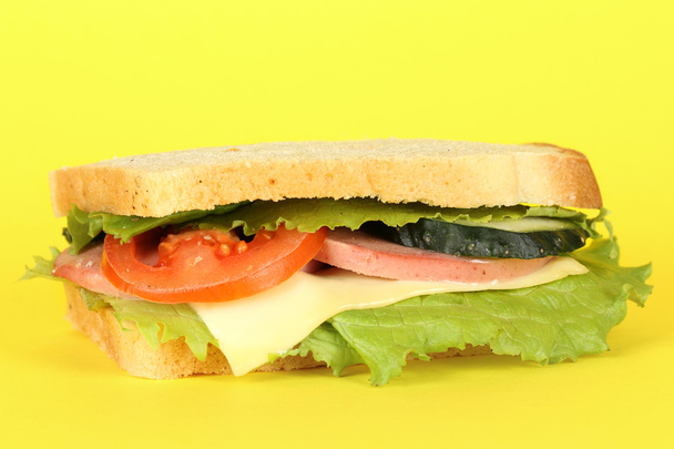 Sandwich on yellow background - Фото, зображення