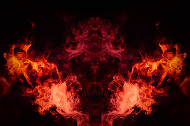 Fantasy print for clothes: t-shirts, sweatshirts.  Colorful pink and red smoke in the form of a skull, monster, dragon on a black isolated background. Background from the smoke of vap - Photo, Image