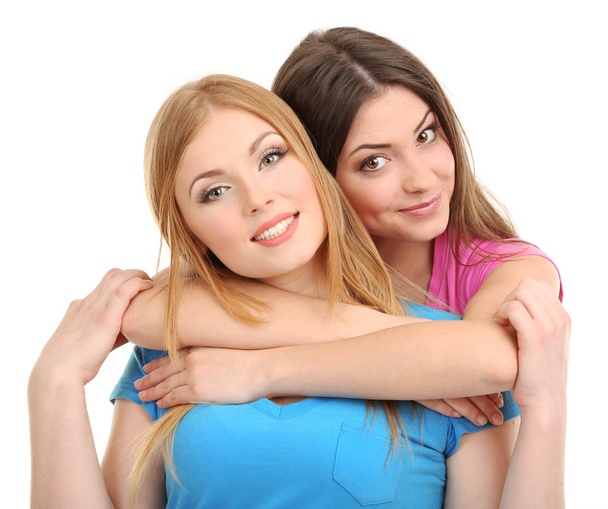Dos amigas abrazándose aisladas en blanco
 - Foto, imagen