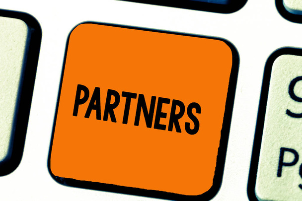 Writing note showing Partners. Business photo showcasing demonstrating who takes part undertaking another especially business - Photo, Image