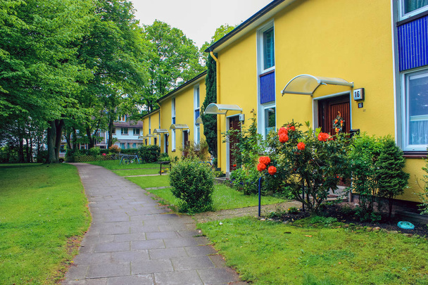 Apartments in townhouses, Altona Germany, june 2010. European apartment building with a lawn green grass. - 写真・画像