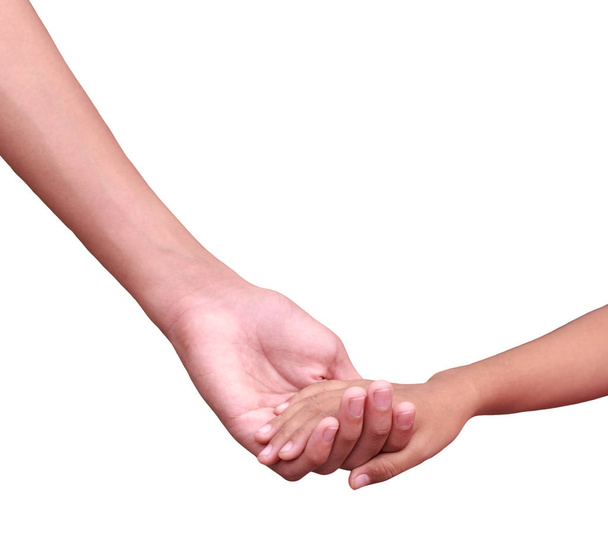 kleinere Hände legen größere Hände mit Liebe und Sorgfalt isoliert auf weiß - Foto, Bild