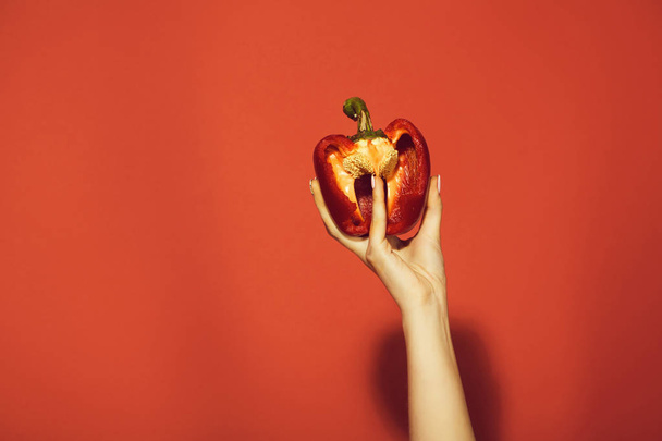 hand of woman hold sweet bell pepper or paprika, heart - Fotografie, Obrázek