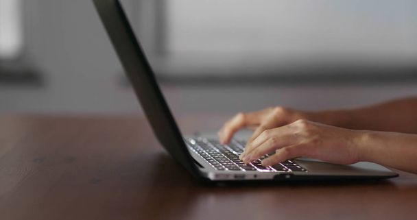 Woman type on laptop computer - 写真・画像
