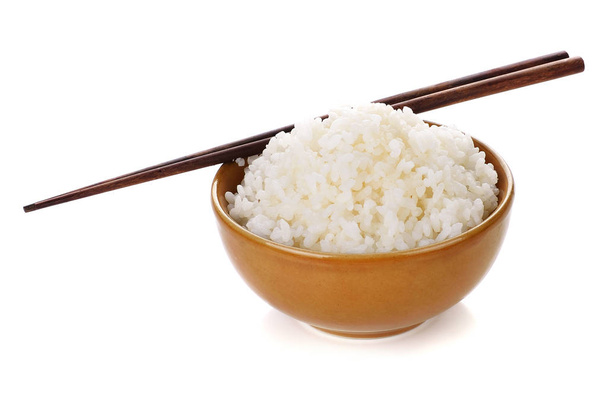 白い背景の茶碗の中の米は - 写真・画像