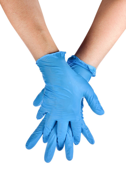 Mani di un medico che indossa guanti di lattice blu
 - Foto, immagini