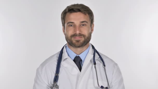 Tired Doctor Looking at Camera in Studio on White Background - Video