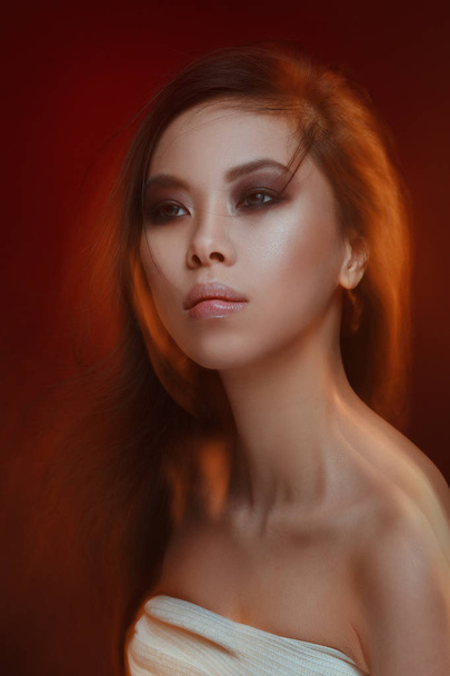 Mystical beauty portrait of a beautiful asian girl with an effect of mixed light. - Fotoğraf, Görsel
