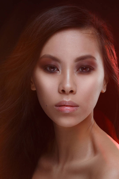 Mystical beauty portrait of a beautiful asian girl with an effect of mixed light. - Fotografie, Obrázek