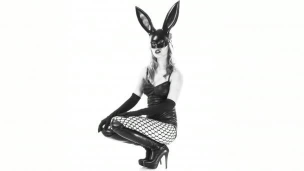 Sexy woman moving in bunny ears mask and black latex body  - Video