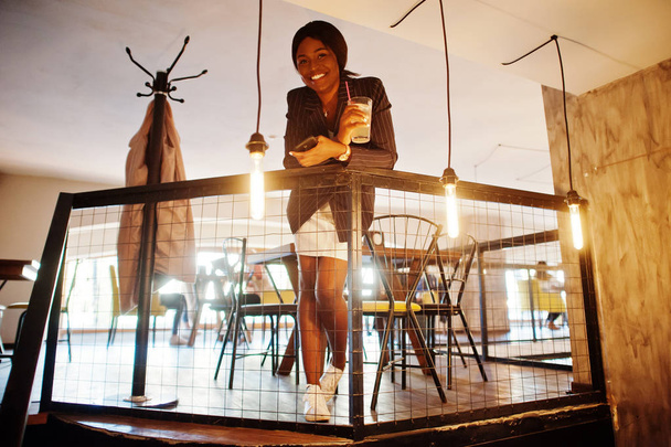 African american businesswoman drinking cocktail lemonade in cafe. Black girl having rest. - Fotografie, Obrázek