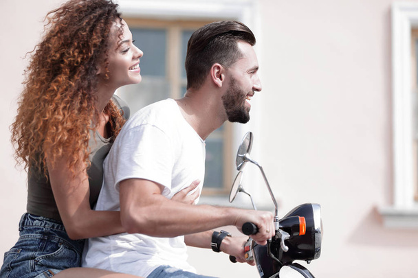 Cool man and beautiful girl riding on  scooter with  expression - Φωτογραφία, εικόνα