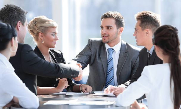 two business partners shaking hands on meeting - Photo, Image