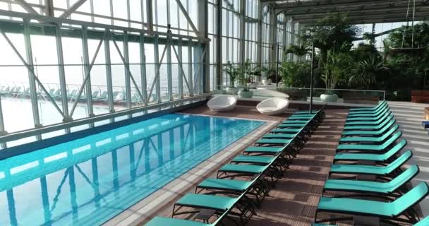 spa interior with swimming pool and deck chairs  - Footage, Video