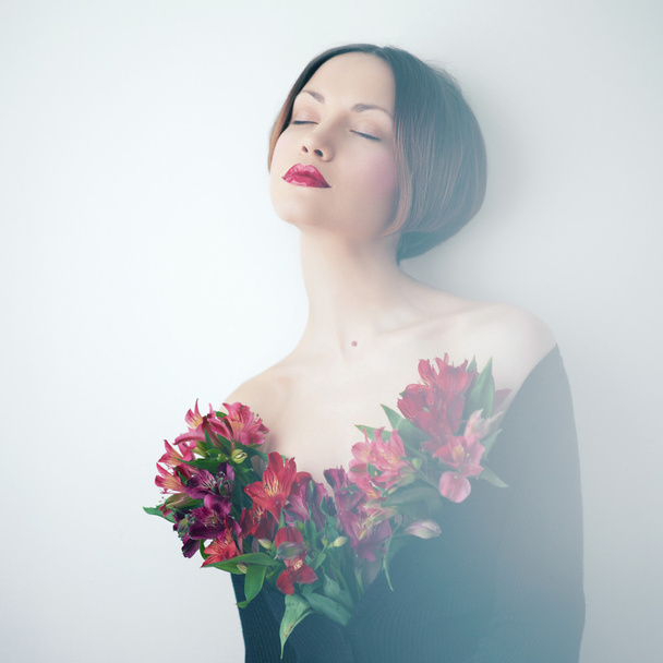 Beautiful lady with flowers - Фото, изображение