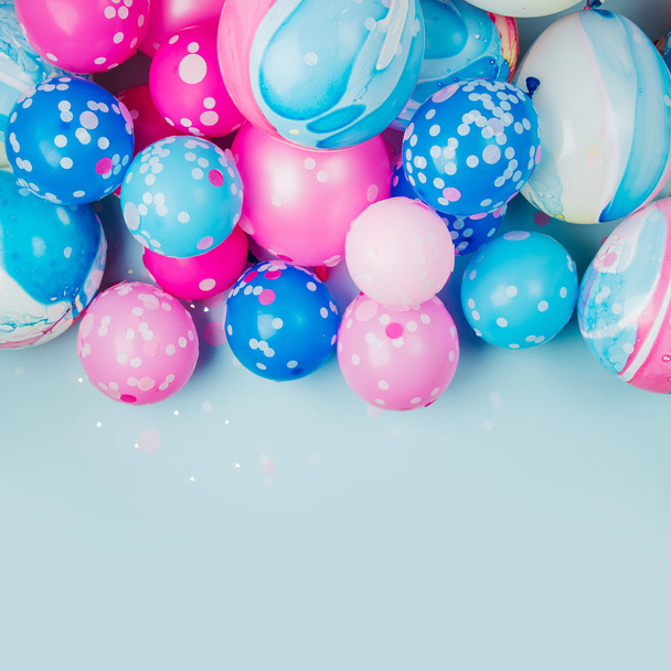 Colorful balloons on pastel colored background - Photo, image