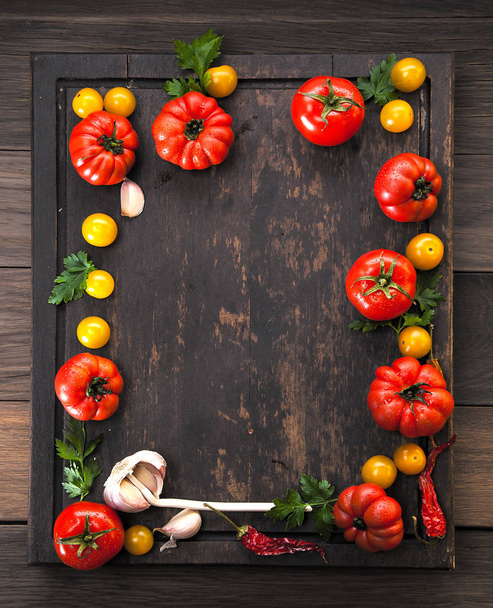 Colorful tomatoes, red , yellow , orange , green on vintage wooden background - Foto, Bild