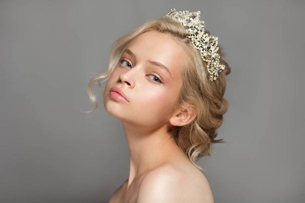 Beautiful blond girl in the image of a bride with a tiara in her hair. - Fotografie, Obrázek