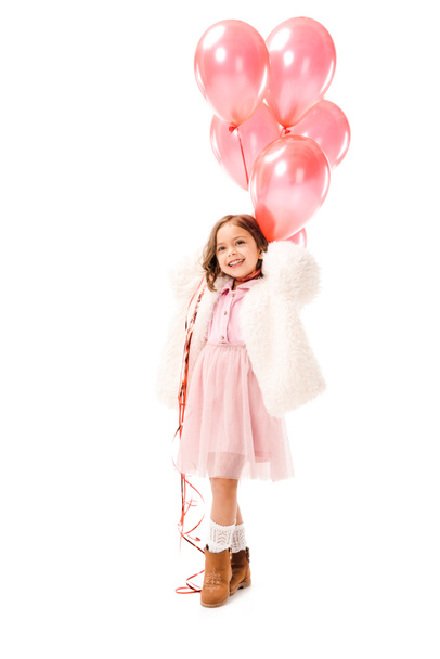 happy little child in stylish clothes with pink air balloons isolated on white - Zdjęcie, obraz