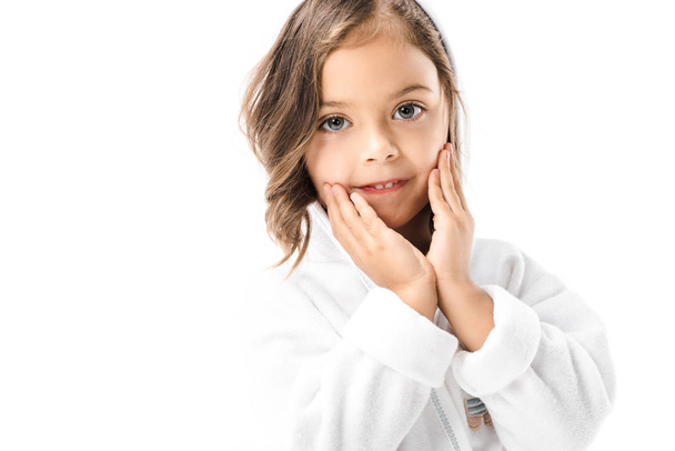little child in white bathrobe looking at camera isolated on white - Foto, Imagen