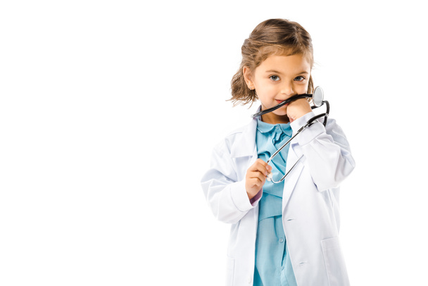 kid dressed in doctors white coat with stethoscope isolated on white - 写真・画像