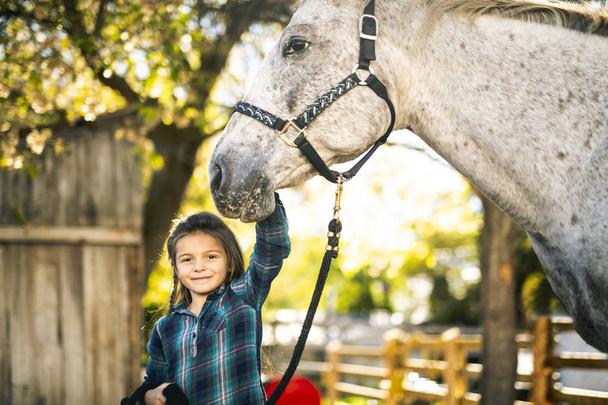 in a beautiful Autumn season of a young girl and horse - Foto, immagini