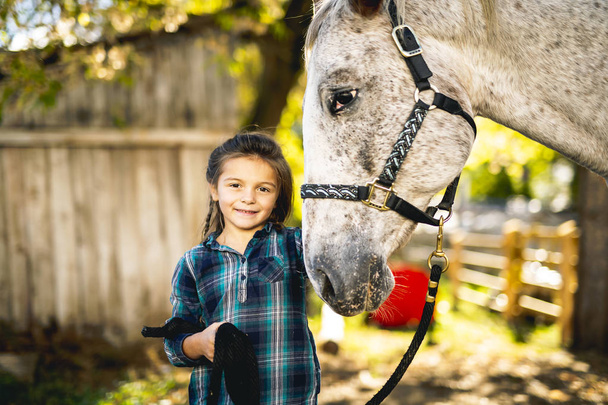 A beautiful Autumn season of a young girl and horse - Fotoğraf, Görsel
