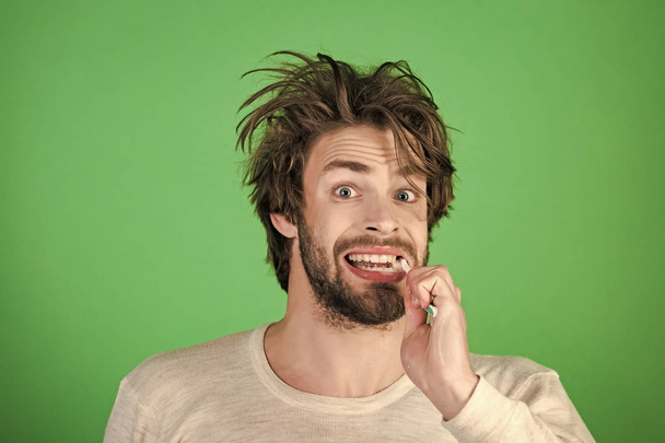 Happy man with beard grooming on green background. - Photo, Image