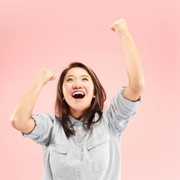 Winning success woman happy ecstatic celebrating being a winner. Dynamic energetic image of female model - Фото, зображення