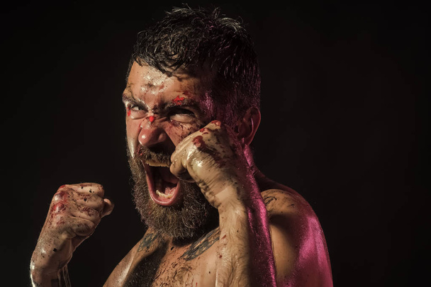 Man shout in fight position with blood on face, fists - Fotoğraf, Görsel