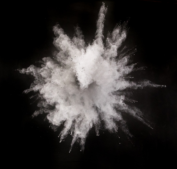 Silver powder explosion on black background. - Photo, Image