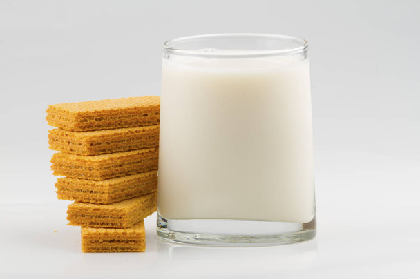 glass with milk and wafer cookies isolated on white background - Photo, Image