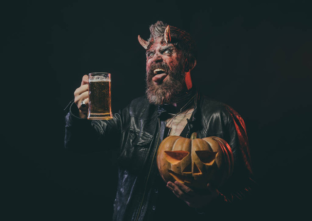 Halloween devil with glass mug show tongue - Zdjęcie, obraz