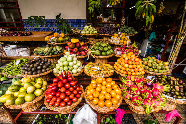 Many fresh and ripe exotic fruits on traditional farmer market Mercado dos Lavradores, Funchal, Madeira, Portugal - Photo, Image