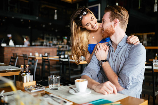 Beautiful man and woman flirt in cafe - Fotoğraf, Görsel