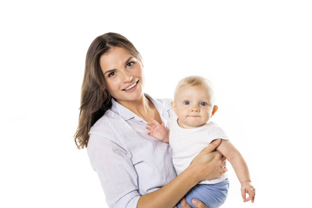 A mother holdng his baby on studio white background - Foto, Bild
