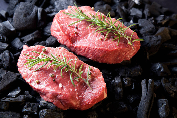 Beef steak on the charcoal. - Фото, изображение