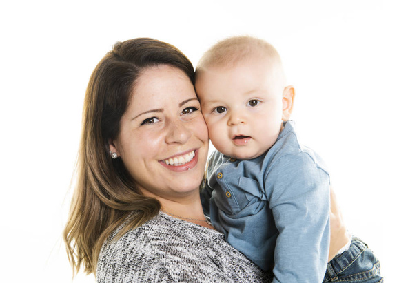 loving mother holding her baby son on white background - Valokuva, kuva