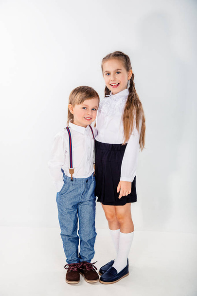 Little cute boy and girl hugging playing on white background, lifestyle people concept. - Fotografie, Obrázek