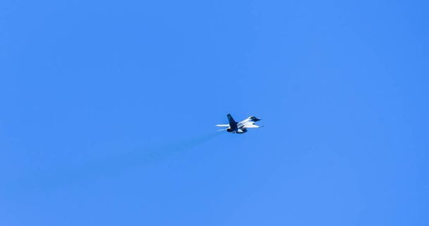 Military aircraft flying over blue sky - Photo, Image