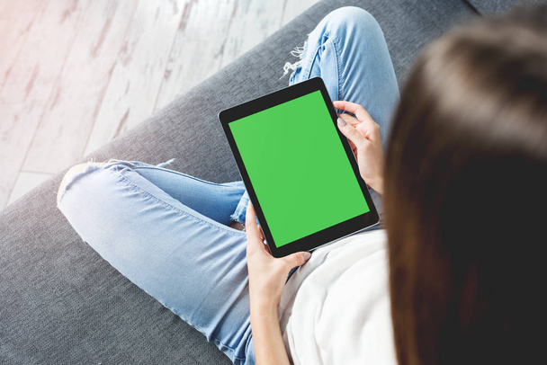 Woman takes a rest with tablet, on sofa - Foto, immagini