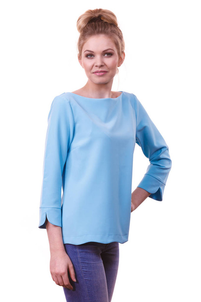 Adult woman presenting her casual beautiful outfit, long sleeved blue top and jeans. - Valokuva, kuva