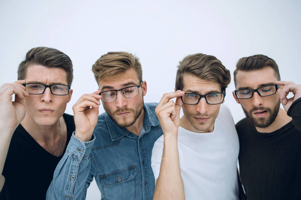 team of businessmen adjusts glasses standing on white background - Photo, Image