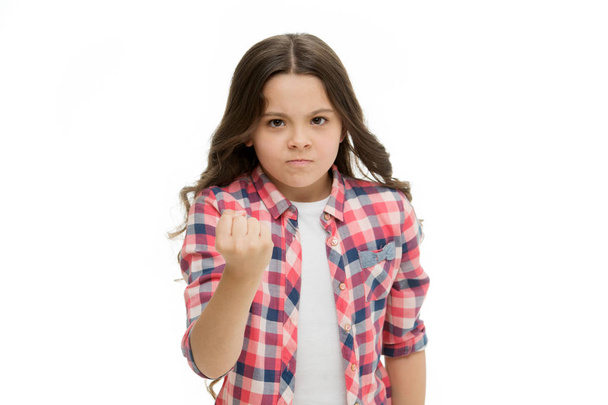 Girl kid threatening with fist isolated on white. Strong personality temper. Threaten with physical attack. Kids aggression concept. Aggressive girl threatening to beat you. Warning stop annoy her - Fotografie, Obrázek